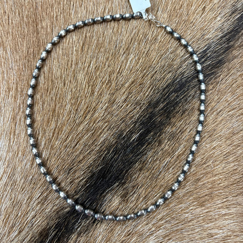 Full view of "Haven" Necklace laying on cowhide