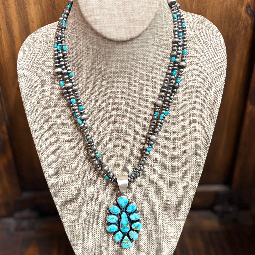 "Cordelia" necklace sitting on mannequin.