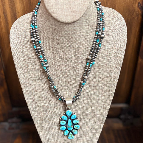 "Cordelia" necklace sitting on mannequin.