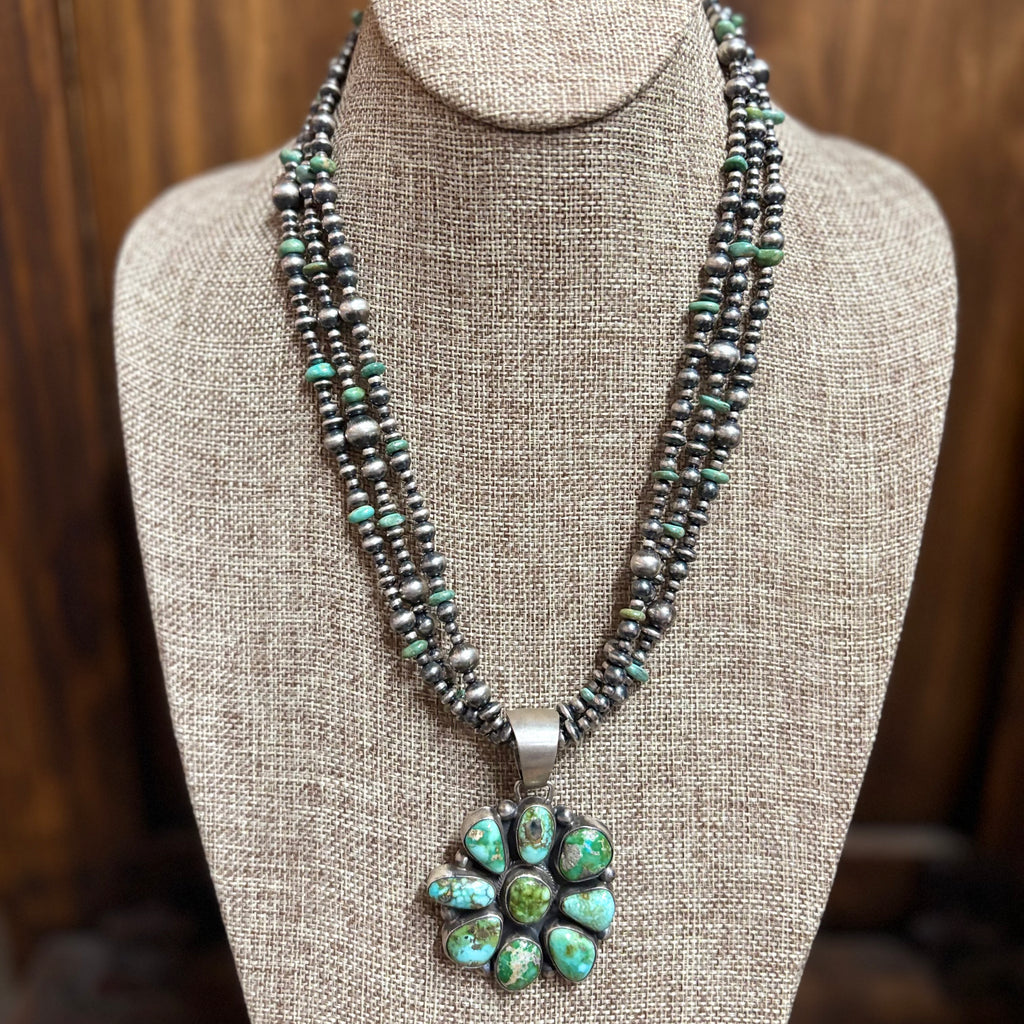 "Bobby" 3 Strand Navajo Pearl & Green Pendant Necklace sitting on mannequin. 