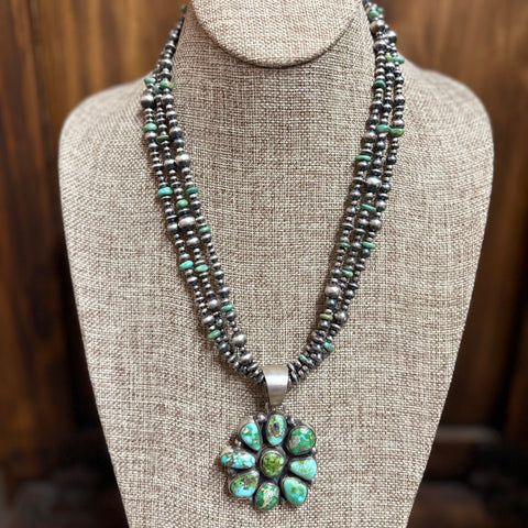 "Bobby" 3 Strand Navajo Pearl & Green Pendant Necklace sitting on mannequin. 