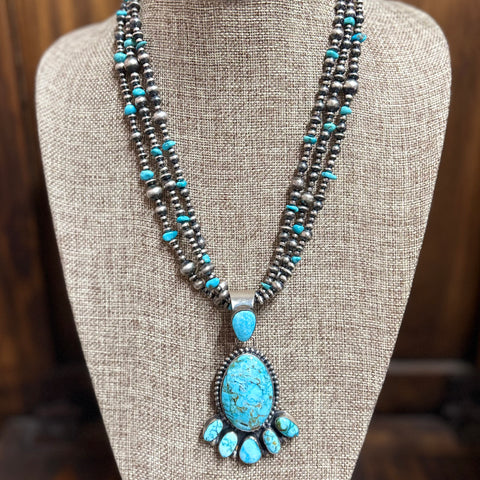 "Klein" 3 Strand Navajo Pearl & Turquoise Necklace sitting on mannequin.