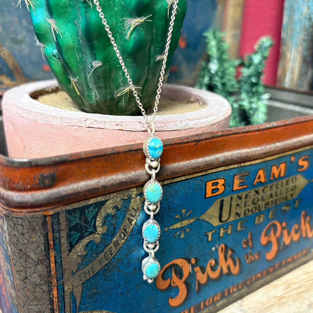 Close view of "Kona" 4 Stone Kingman Turquoise Drop Necklace 