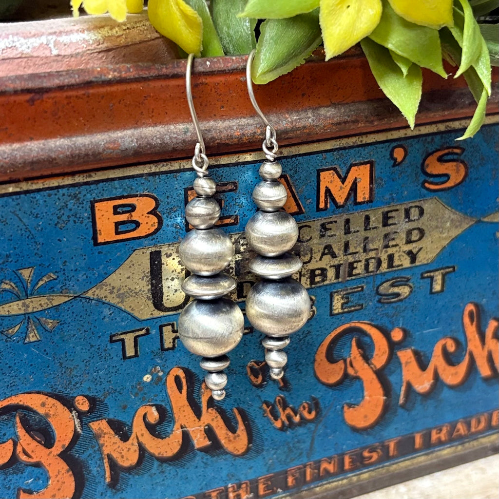 Close up view of "Filly" Navajo Pearl & Disc Dangle Earrings 