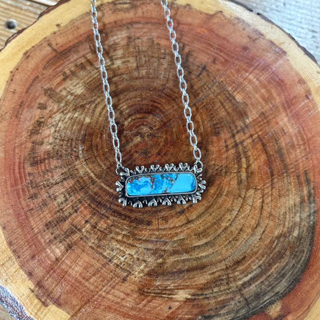 Close up view of Turquoise Pendant & Silver Accent Bar Necklace 