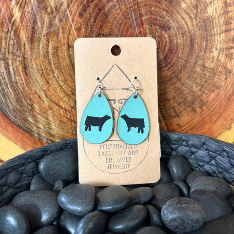 Close up view of Small Teal Show Steer Earrings 