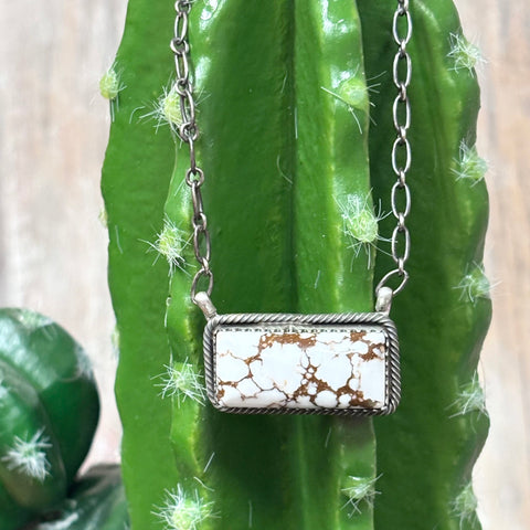 Close up view of a wild horse stone bar necklace