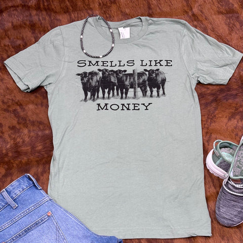 Green Shirt with "Smells Like Money" Saying and Cow graphics