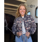 Women's quilted zip-up jacket with Aztec pattern in rich, earthy tones 