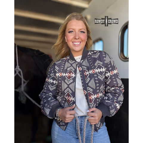 Women's quilted zip-up jacket with Aztec pattern in rich, earthy tones 