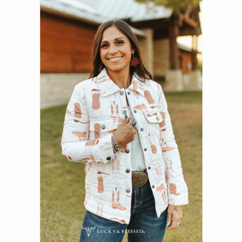 Woman wearing white quilted jacket with brown boots print