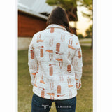Back view of woman wearing white quilted jacket with brown boots print