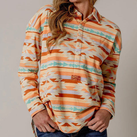 Orange, red, and turquoise Aztec print 1/4 snap long sleeve shirt.