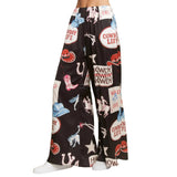 Wide b;ack pants with cowboy-themed pattern