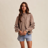 woman wearing a Lace Ruffle Sleeve Pintuck Blouse