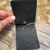 Inside of black elephant money clip with money clip.