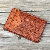 Light brown card holder with money clip.