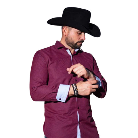 Burgundy long sleeve button down shirt that features light blue contrast fabric on the inside of the cuffs and down the middle. 