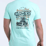 Back side view of teal t-shirt with large "America's Finest Farmers" motif that features a combine. 