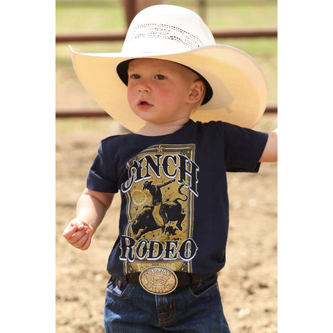 Toddler wearing the Navy Cinch Rodeo Tee, front view showing the bold bull‑rider graphic and classic crew‑neck fit 