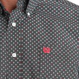 Close up view of the shirt print, left open chest pocket has a red embroidered Cinch logo. 