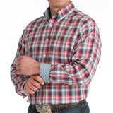  Model wearing a classic multicolor plaid shirt showing left open 
pocket and logo