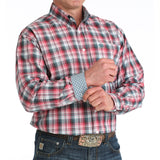 Model wearing a classic multicolor plaid shirt, showing contrast cuffs. 
