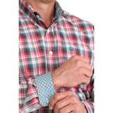 Close‑up of the classic multicolor plaid shirt on the model, showing the detailed plaid pattern and button‑down collar.
