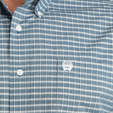Close up view of the single chest pocket, it features a white embroidered Cinch logo. 
