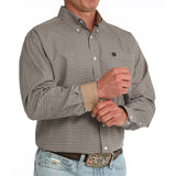 Model turned to the side in Cinch Men’s Khaki Geo Print Button-Up, showing pattern and fit.