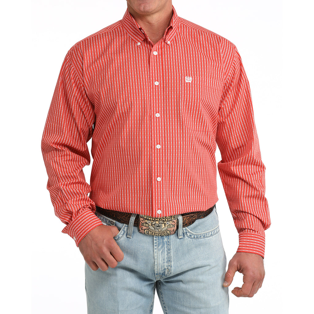 Model wearing the Cinch Men’s Red Geo Print Striped Button-Up, showing bold red pattern and classic Western fit.