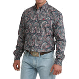 Side view of model in the Cinch Men’s Paisley Long Sleeve Teal Shirt highlighting the sleeve length, tailored silhouette, and detailed paisley print.