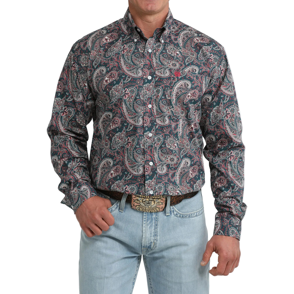 Model wearing the Cinch Men’s Paisley Long Sleeve Teal Shirt, front view showing the teal paisley pattern, button‑down front, and classic Western fit.