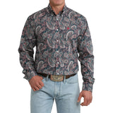 Model wearing the Cinch Men’s Paisley Long Sleeve Teal Shirt, front view showing the teal paisley pattern, button‑down front, and classic Western fit.