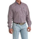 Angled view of model in Cinch Men’s Purple Geo Print Shirt, highlighting sleeve detail, tailored silhouette, and purple geo design.