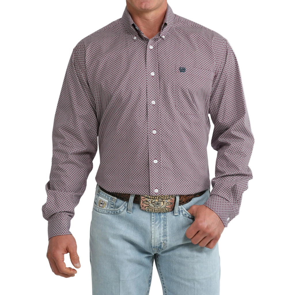 Model wearing the Cinch Men’s Purple Geo Print Long Sleeve Shirt, showing the bold geometric pattern and classic Western button‑down fit.