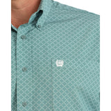 Close‑up of the blue printed pattern on the Cinch Men’s ArenaFlex Shirt worn by a male model.