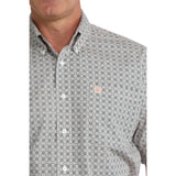 Close‑up of model in Cinch Men’s Grey and White Geo Print Short Sleeve Shirt, focusing on collar, buttons, and detailed grey‑white print.