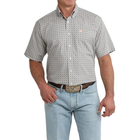 Model wearing the Cinch Men’s Grey and White Geo Print Short Sleeve Shirt, showing the bold geometric pattern and classic Western fit.