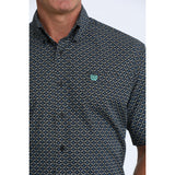 Close up of black shirt with turquoise print, black buttons and turquoise cinch logo.