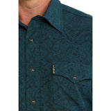 Close‑up of model in Cinch Men’s Teal Paisley Shirt, focusing on collar, buttons, and chest pocket.