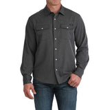 Model wearing the Cinch Black Stretch Ripstop Camp Shirt in a front view, showing the lightweight stretch ripstop fabric, double chest pockets, and Western snap‑front design.
