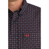 Close‑up of model in the Cinch Navy Geo Print Short Sleeve Shirt focusing on the collar, buttons, and detailed navy geo print.