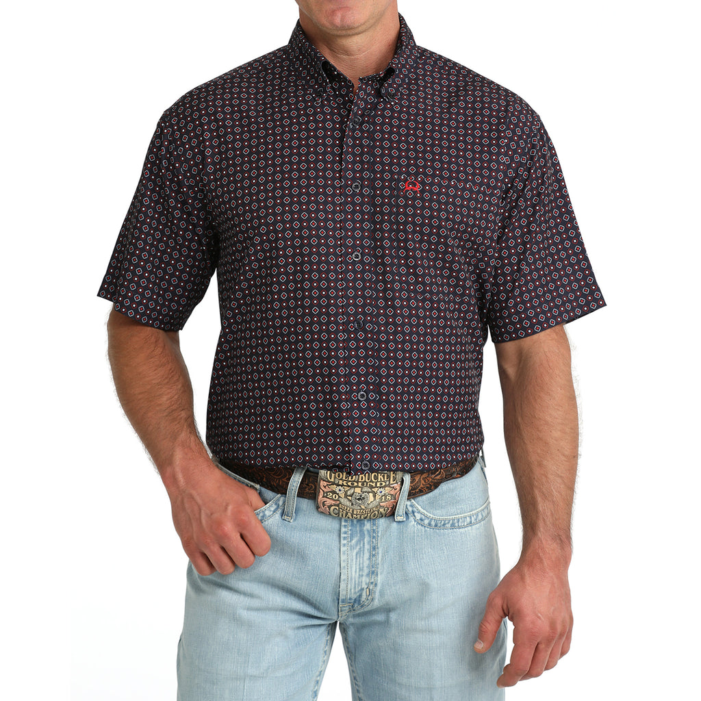 Model wearing the Cinch Navy Geo Print Short Sleeve Shirt, front view showing the navy geometric pattern, button‑down front, and classic Western fit.