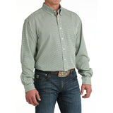 Man wearing the Cinch Green Geo Print Long Sleeve Shirt, side angle highlighting the long sleeves and crisp geometric print.