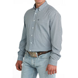 Side view of model in Men’s Cinch Light Blue Geo Print Shirt, highlighting sleeve detail, tailored fit, and light blue print.