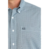 Close‑up of model in Men’s Cinch Light Blue Geo Print Shirt, focusing on collar, buttons, and detailed geometric print.