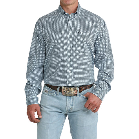 Model wearing the Men’s Cinch Light Blue Geo Print Long Sleeve Shirt, showing the geometric pattern and classic Western button‑down fit.