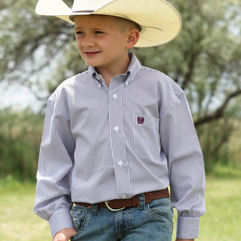 Front facing boy model wearing the Cinch purple and white long sleeve shirt