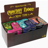Display of cowboy boot-shaped mint tins with decorative designs in a box.